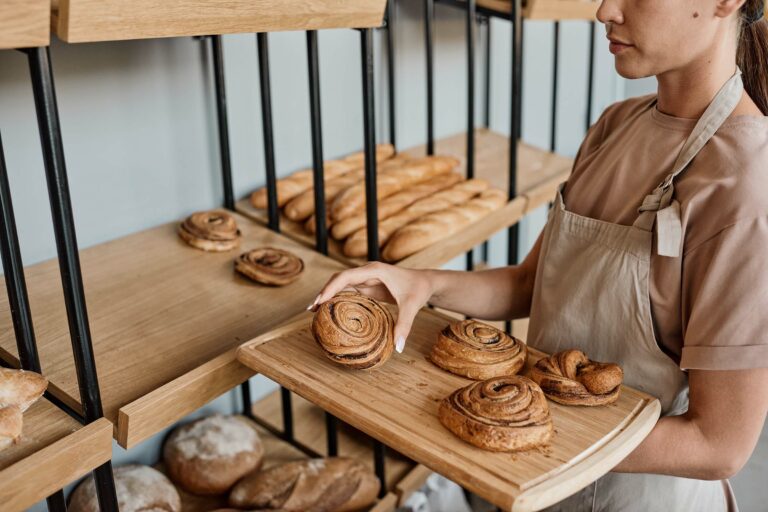 woman-with-tray-in-bakery-XDW7NK5.jpg
